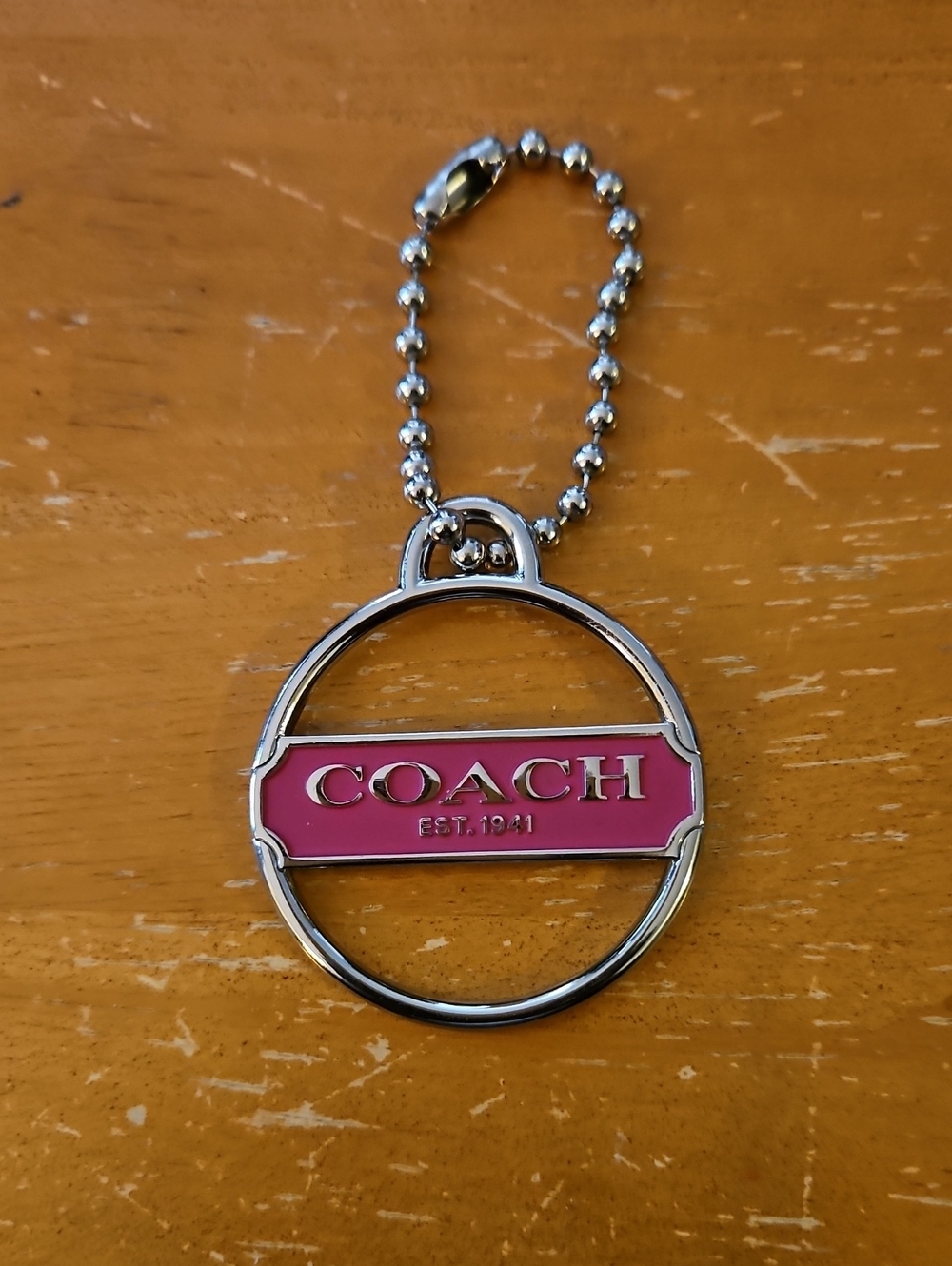 Coach Silver-Tone Keyring with Pink Enamel Logo